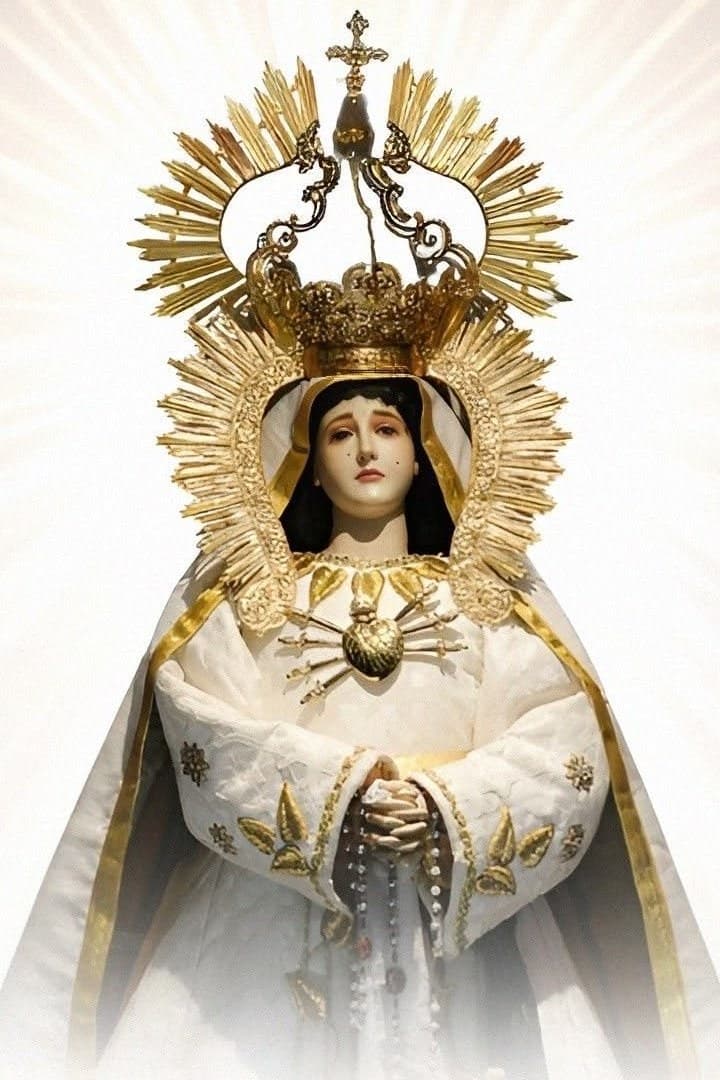 The parish image of Our Lady of Sorrows, crowned and vested in white, bearing the seven swords of the Sorrowful Heart